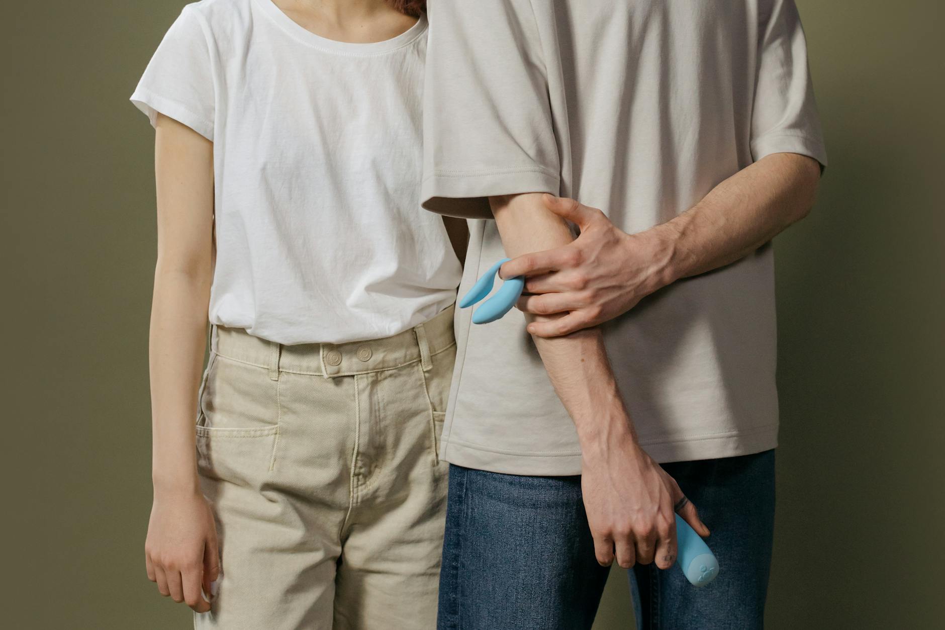 A couple exploring lemon vibrators together indoors, symbolizing modern intimacy and shared discovery.